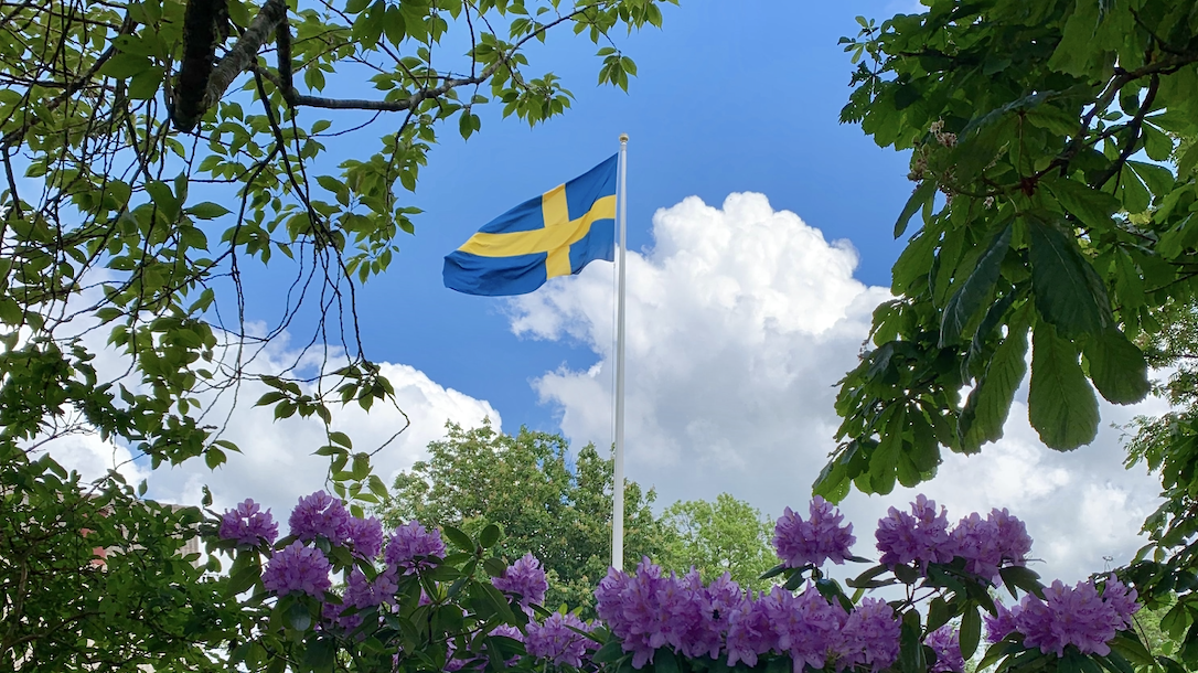 Swedish flag on a summer sky