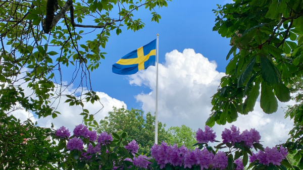 Swedish flag on a summer sky